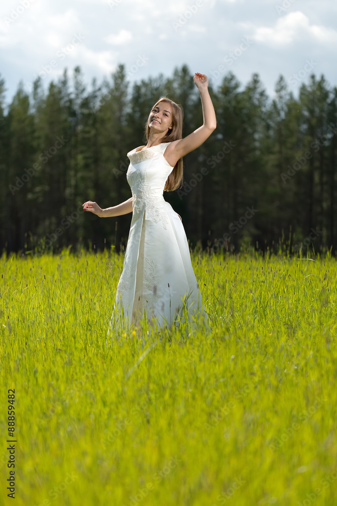 young girl in a wedding dress smiling and dancing young girl in a wedding dress smiling and dancing