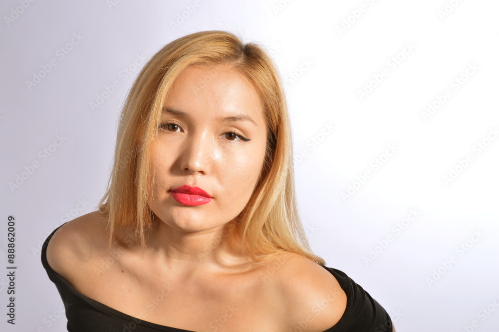 Beautiful Kazakh model on a gray gradient background Beautiful Kazakh model on a gray gradient background