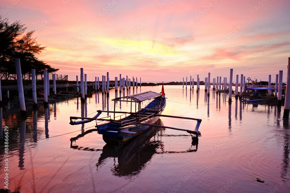 Fototapeta premium Fisherman boat and the sunset