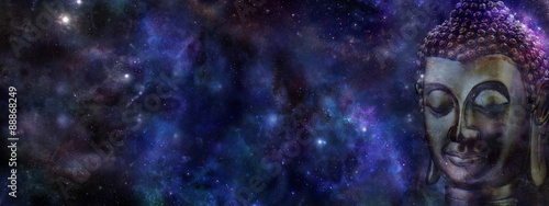 Buddha on deep space background website header - Wide deep blue night sky with a cropped head of Buddha on right hand side and plenty of copy space on left 