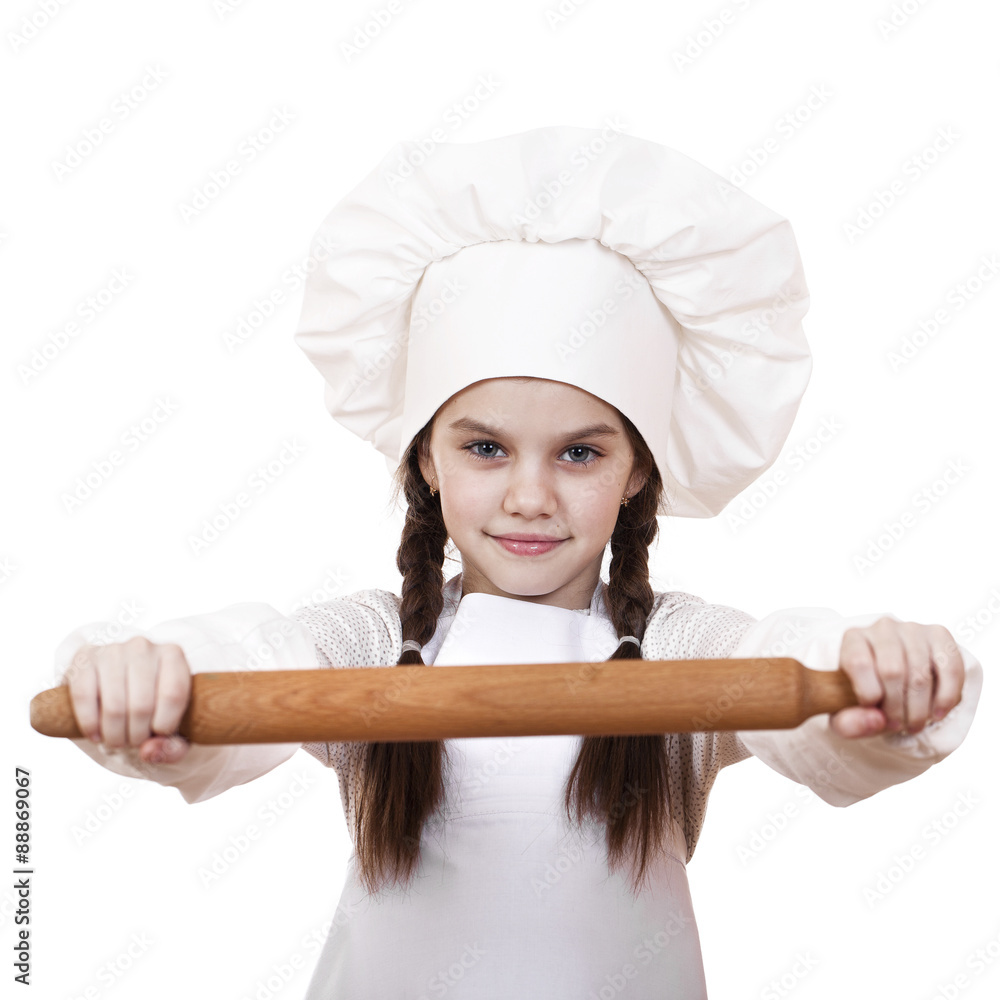 Сute little girl baking on kitchen and shows rolling-pin Сute little girl baking on kitchen and shows rolling-pin