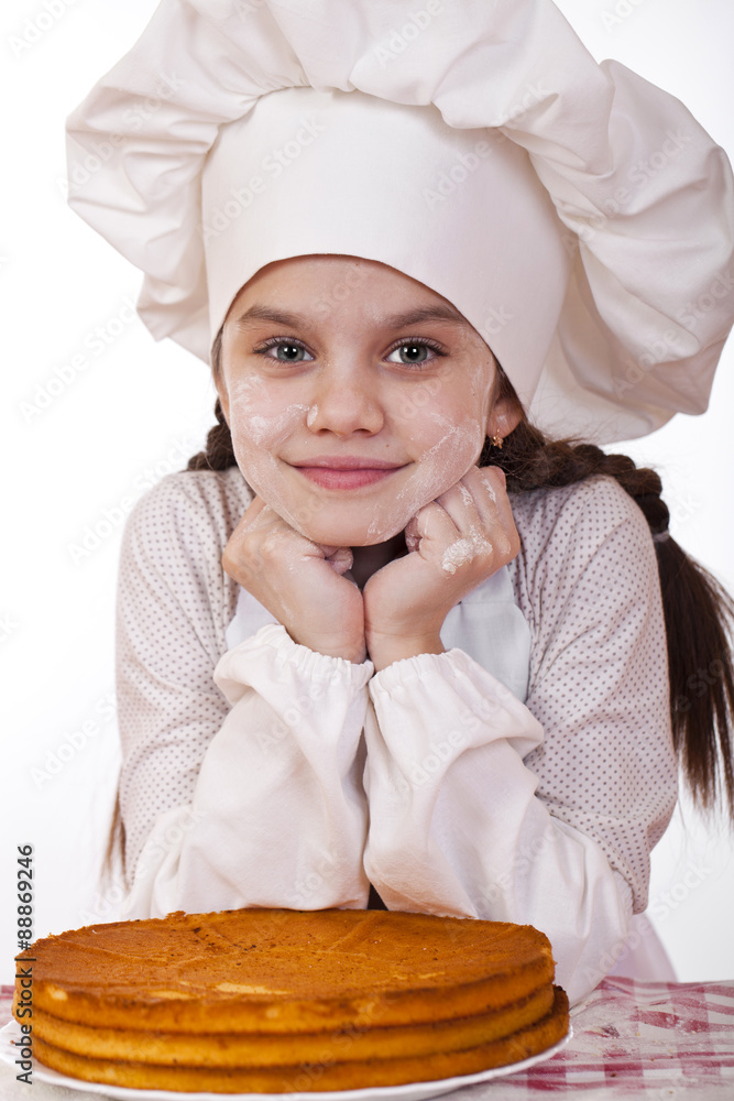 Cooking and people concept - smiling little girl in cook hat Cooking and people concept - smiling little girl in cook hat