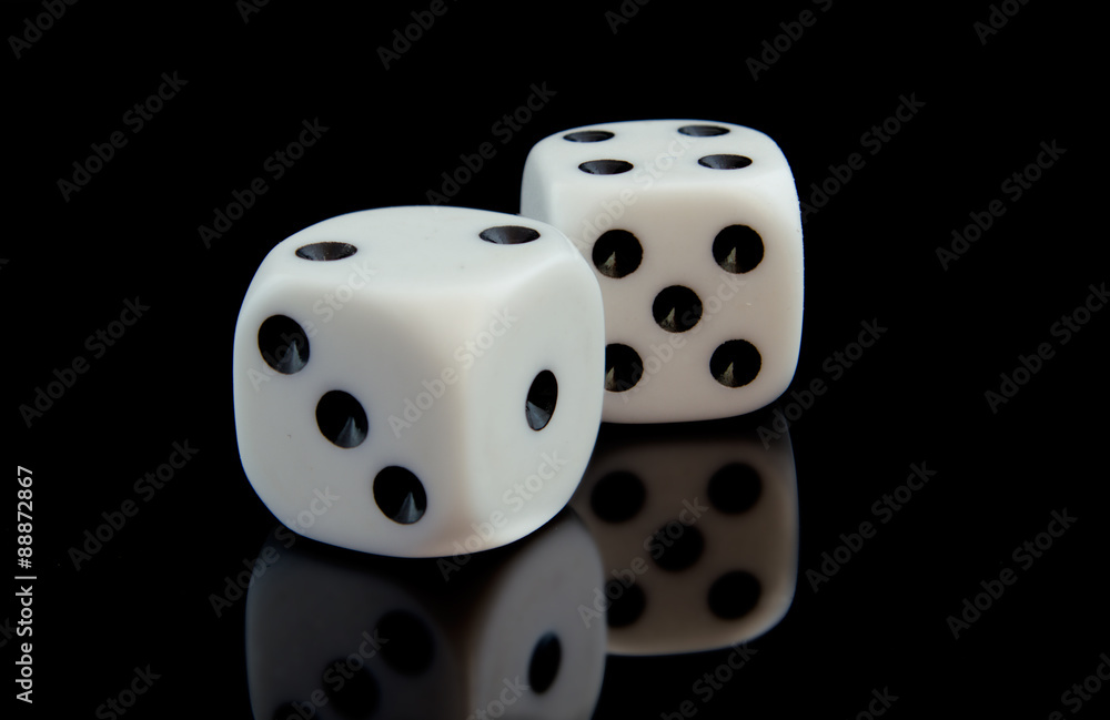 Two game cubes on the black reflecting surface. Two game cubes on the black reflecting surface.