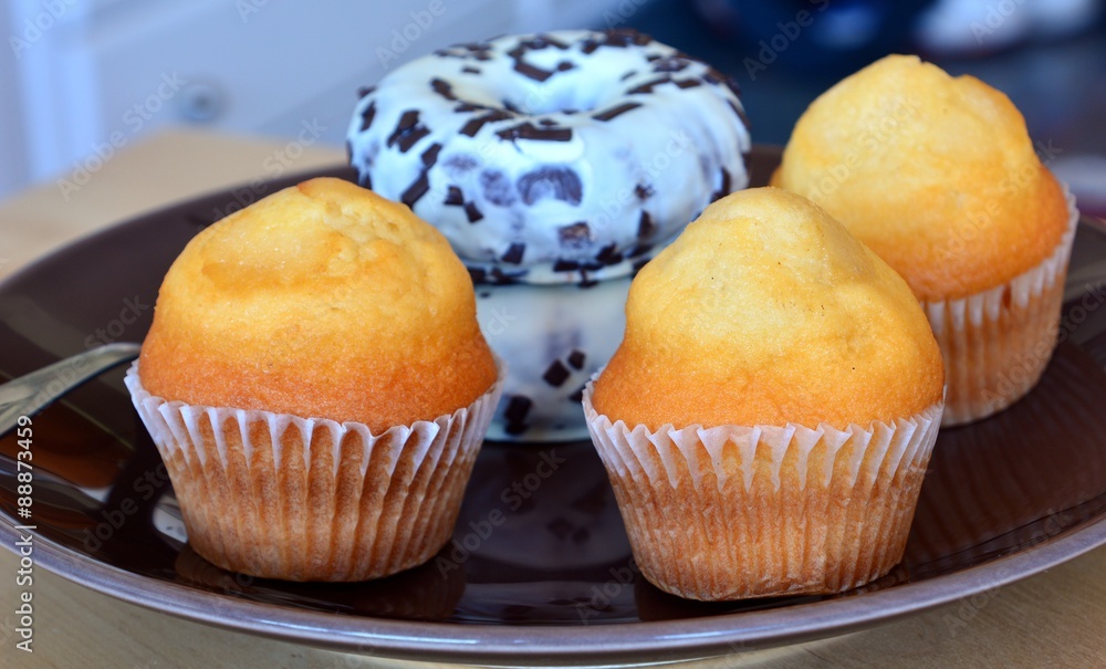 Homemade Muffins With Donuts On A Wooden Table Homemade Muffins With Donuts On A Wooden Table