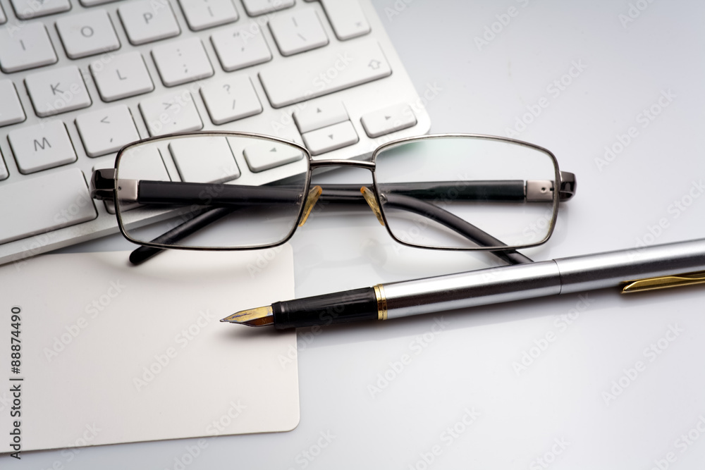 Glasses, pen and laptop Glasses, pen and laptop