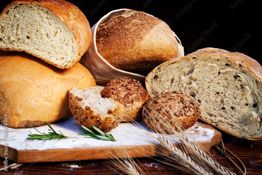 fresh bread and wheat on the wooden table
