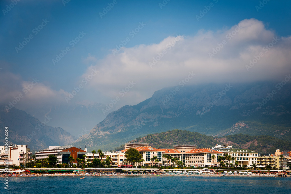 Coastline with hotels in Kemer and mountain behind