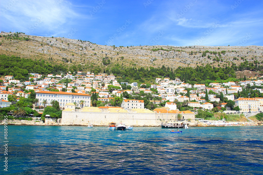 Monumental building Lazareti in Dubrovnik with boats in the sea