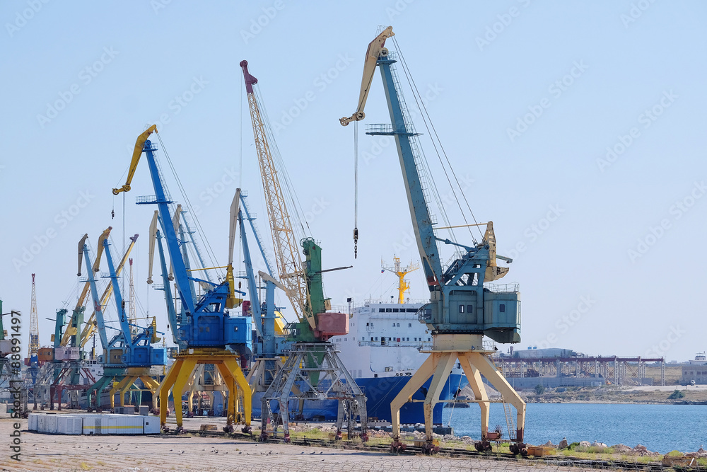 the image of sea port tower cranes
