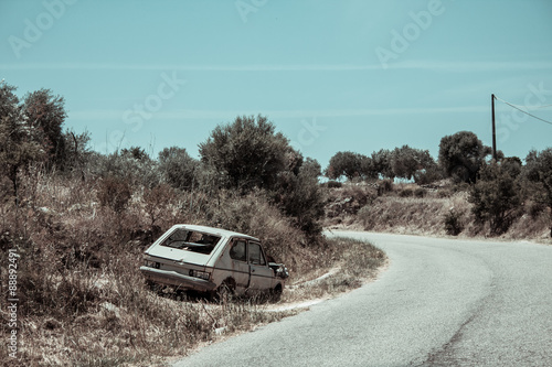 Abandoned car and road