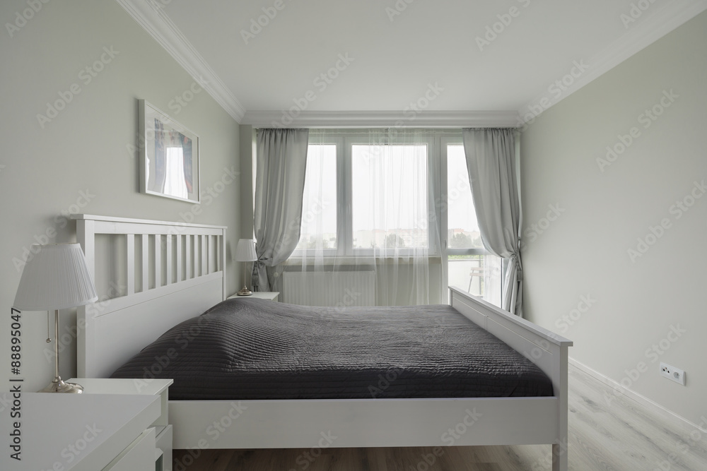 Large bed with black bedding Large bed with black bedding