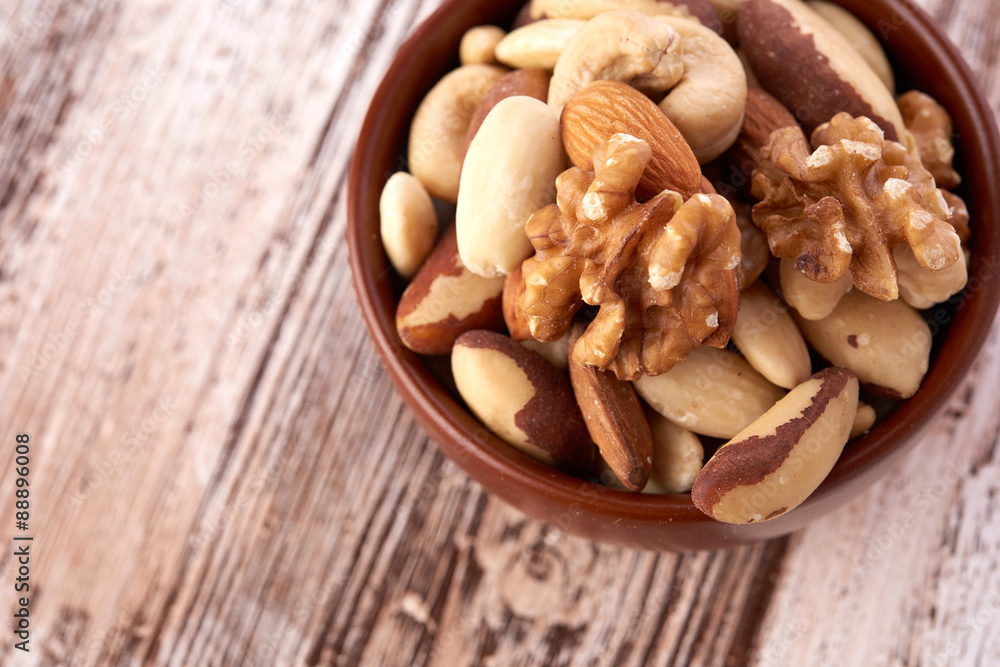 Mix nuts on wooden background Mix nuts on wooden background