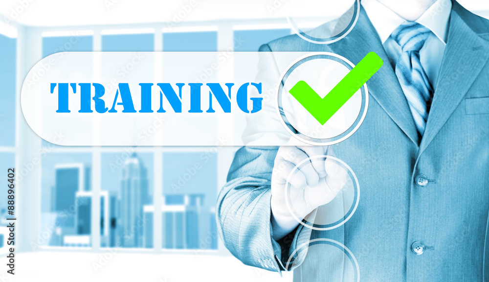 Businessman pressing touch screen interface training checkbox Businessman pressing touch screen interface training checkbox