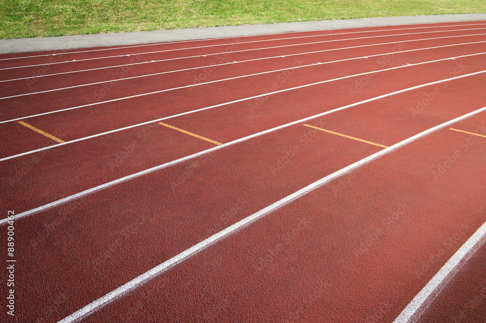 Athletic running track in modern red rubber close-up abstract background