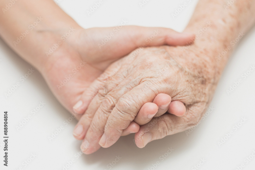 Help concept,The helping hands for elderly home care, Holding hand, noise and film grain style. Help concept,The helping hands for elderly home care, Holding hand, noise and film grain style.