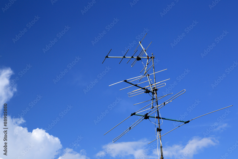 analog tv antenna with blue sky background analog tv antenna with blue sky background