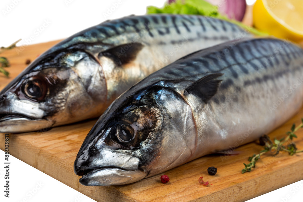 two fresh uncooked mackerel with lemon, onion, spices two fresh uncooked mackerel with lemon, onion, spices