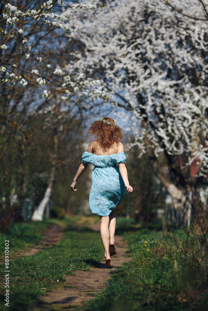 Beautiful girl follows a country road Beautiful girl follows a country road