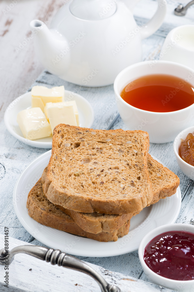 Breakfast with toast, jam and black tea, vertical Breakfast with toast, jam and black tea, vertical