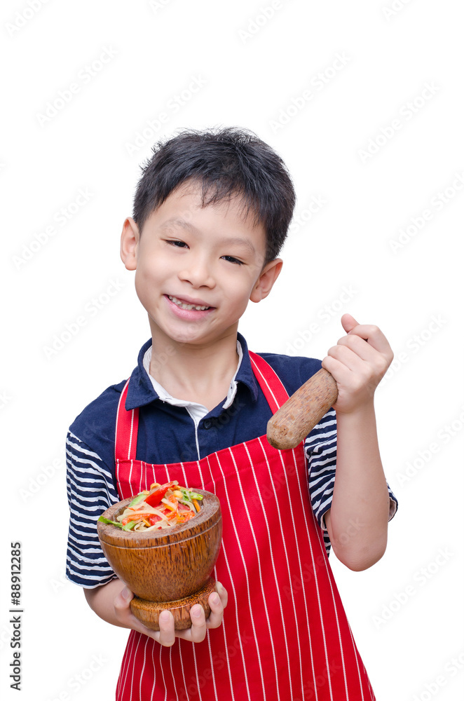 Asian boy chef with papaya salad ,very famous Thai food over whi Asian boy chef with papaya salad ,very famous Thai food over whi