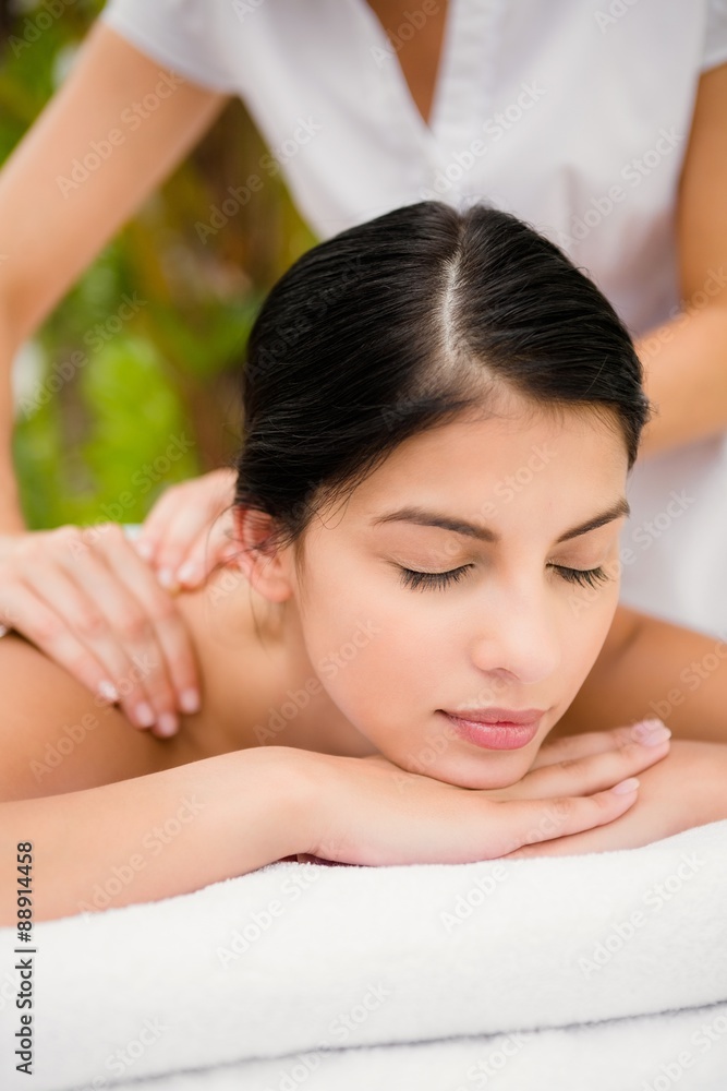 Attractive woman receiving back massage Attractive woman receiving back massage