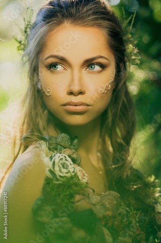 Fototapeta Naklejka Na Ścianę i Meble -  Elf woman in a magical forest