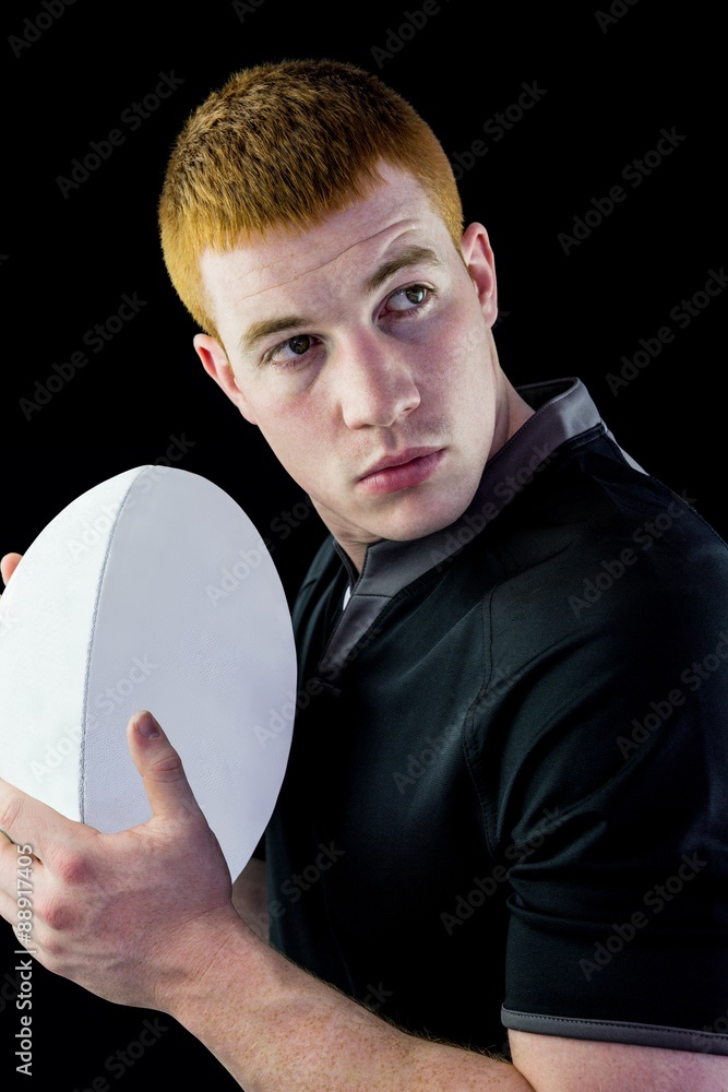 Rugby player holding a rugby ball Stock Photo Adobe Stock