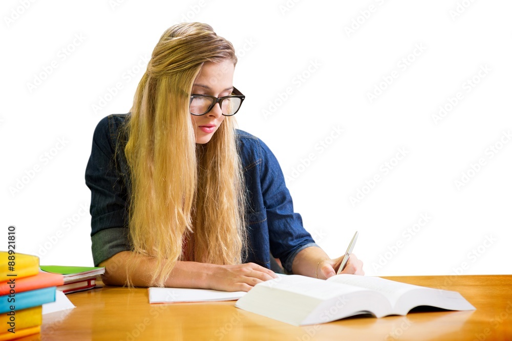 Composite image of student studying in the library Composite image of student studying in the library