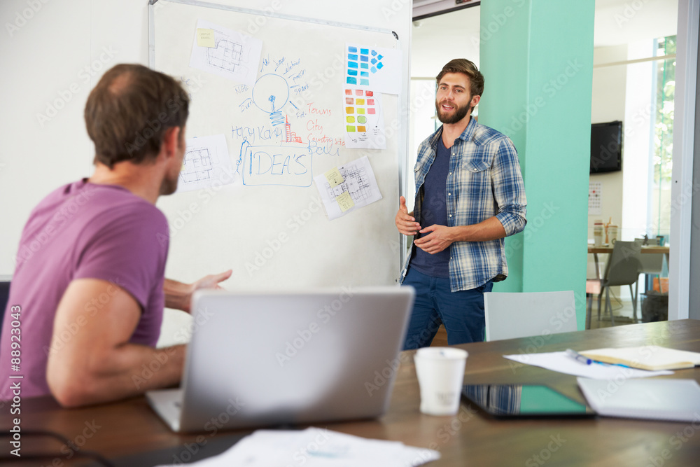 Two Businessmen Having Creative Meeting In Office Two Businessmen Having Creative Meeting In Office