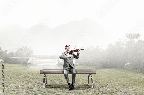 Businessman play violin