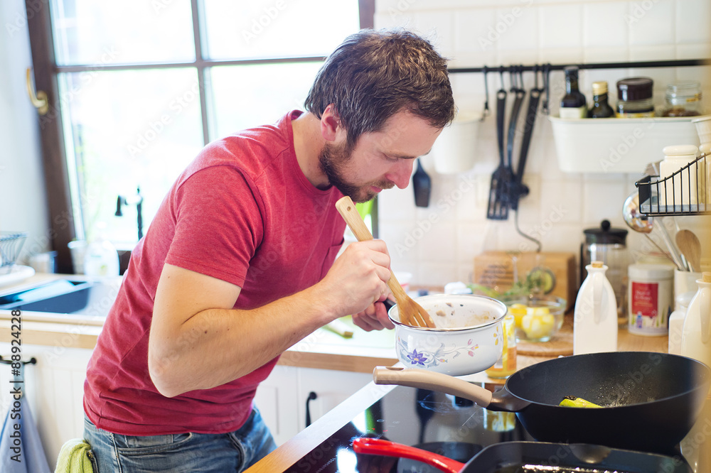 Man preparing creamy mushroom sauce Man preparing creamy mushroom sauce