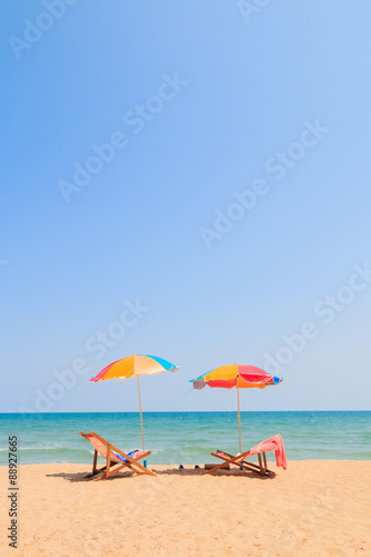 Fototapeta Naklejka Na Ścianę i Meble -  Beach chair and umbrella on sand beach