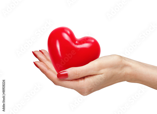 Red heart in woman hand  isolated on white