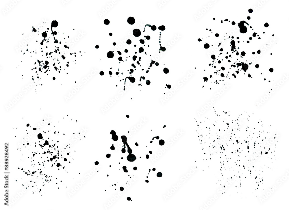 Black ink spray drops isolated on white background.