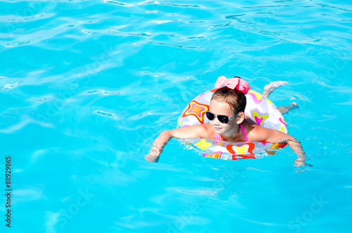 Smiling little girl in swimming pool © svetamart