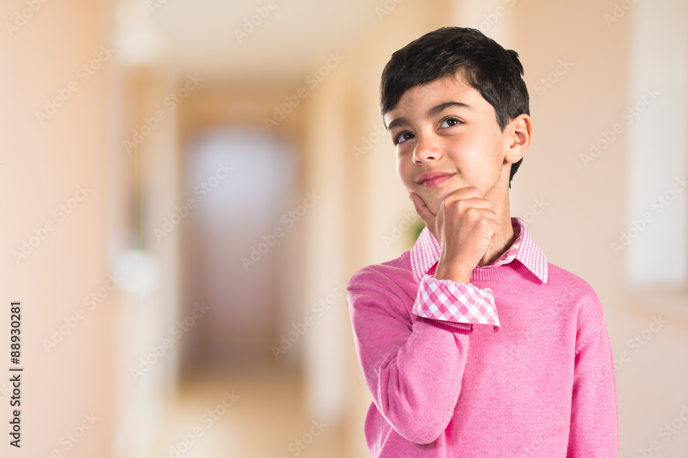 Kid thinking over white background Kid thinking over white background