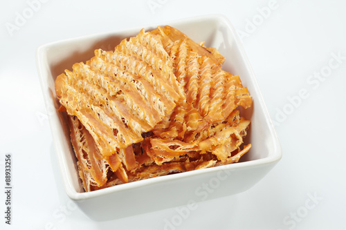 Dry squid in white bowl