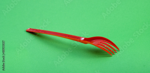 Red plastic disposable fork