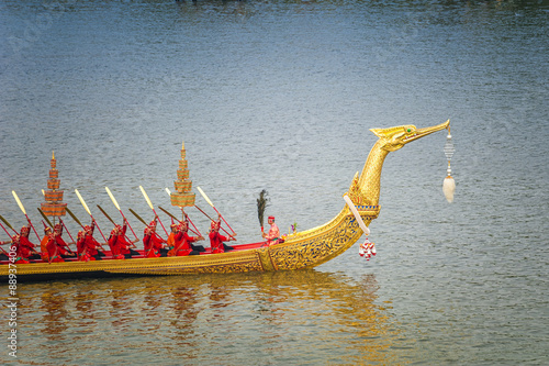 Landscape of Thai's king palace with goldent guard ship on the front.