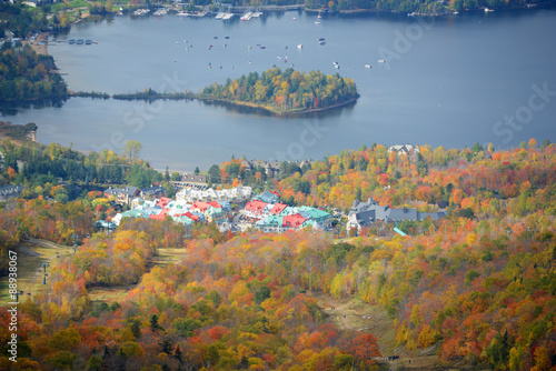 Lake Tremblant and Mont-Tremblant village in fall with fall foliage, from top of Mont Tremblant, Quebec, Canada.