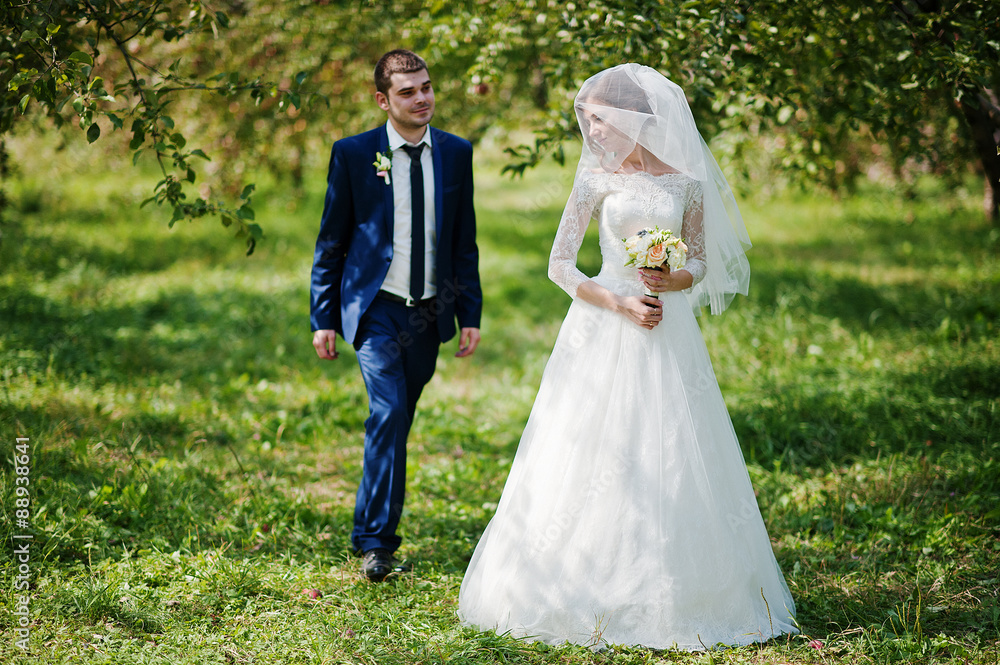 Loving wedding couple at the garden