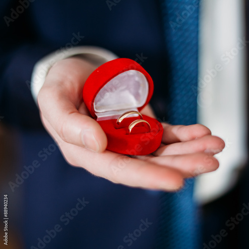 Groom Man Holding Holding Box With Wedding Rings