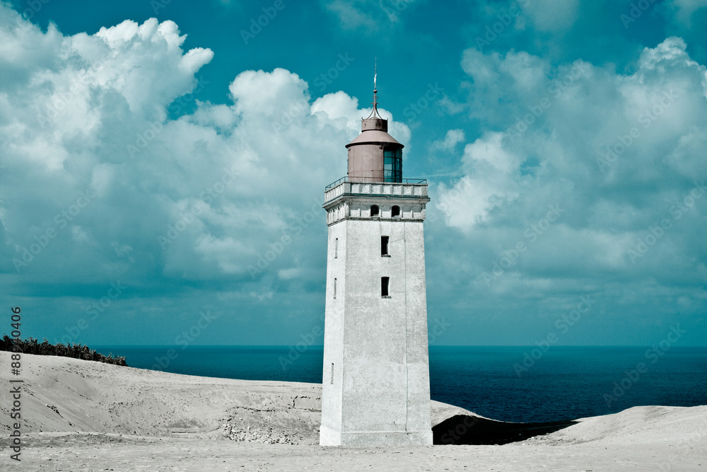 Lighthouse, sand and sea