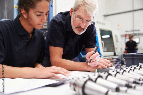 Engineer And Apprentice Planning CNC Machinery Project photo