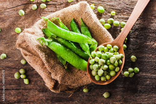 Spoon of fresh green peas