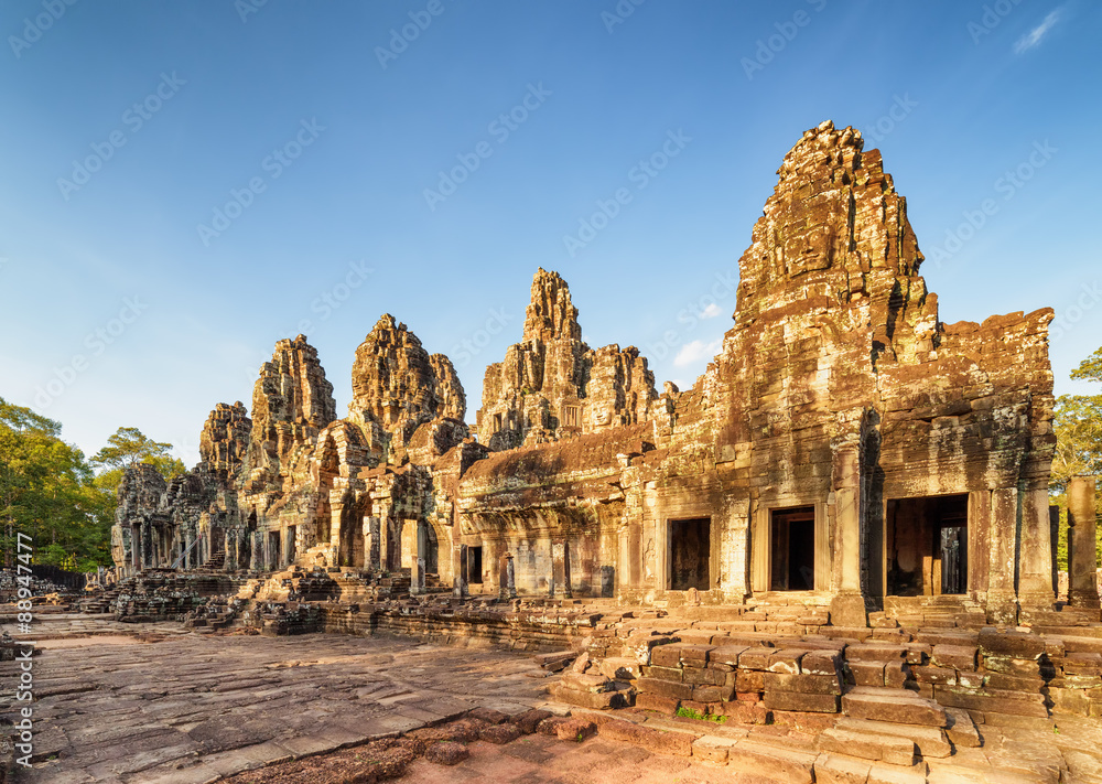 Ruins of Bayon temple in Angkor Thom in evening sun, Cambodia