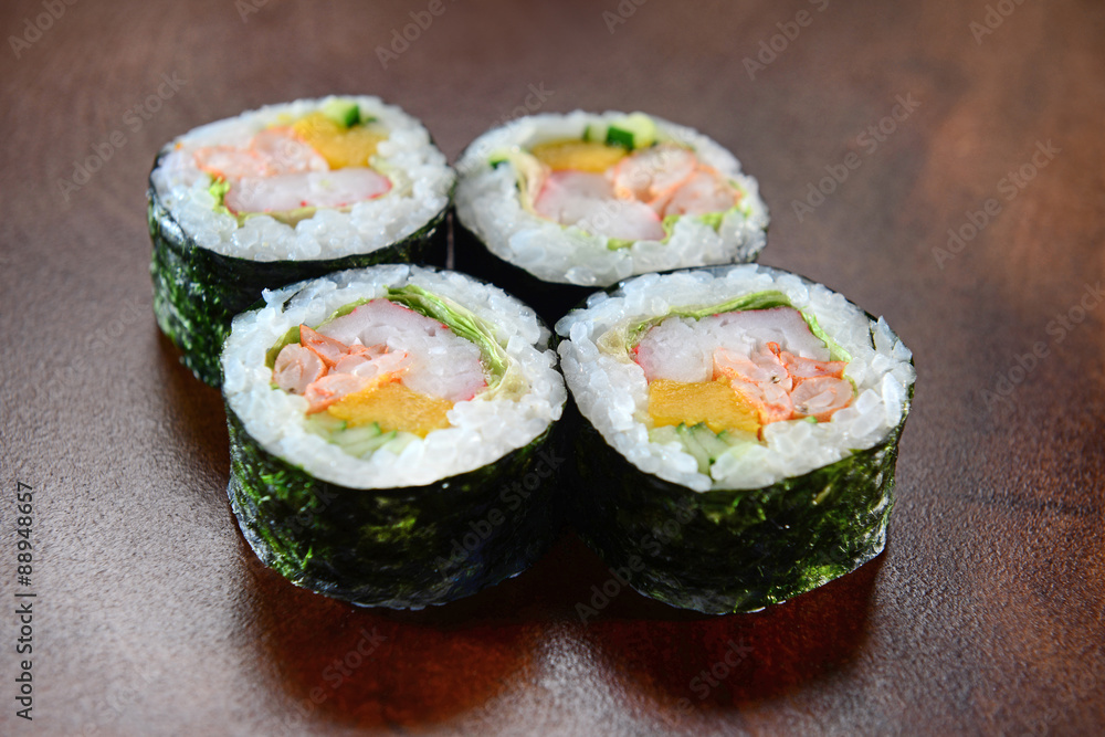 Sushis on wooden background