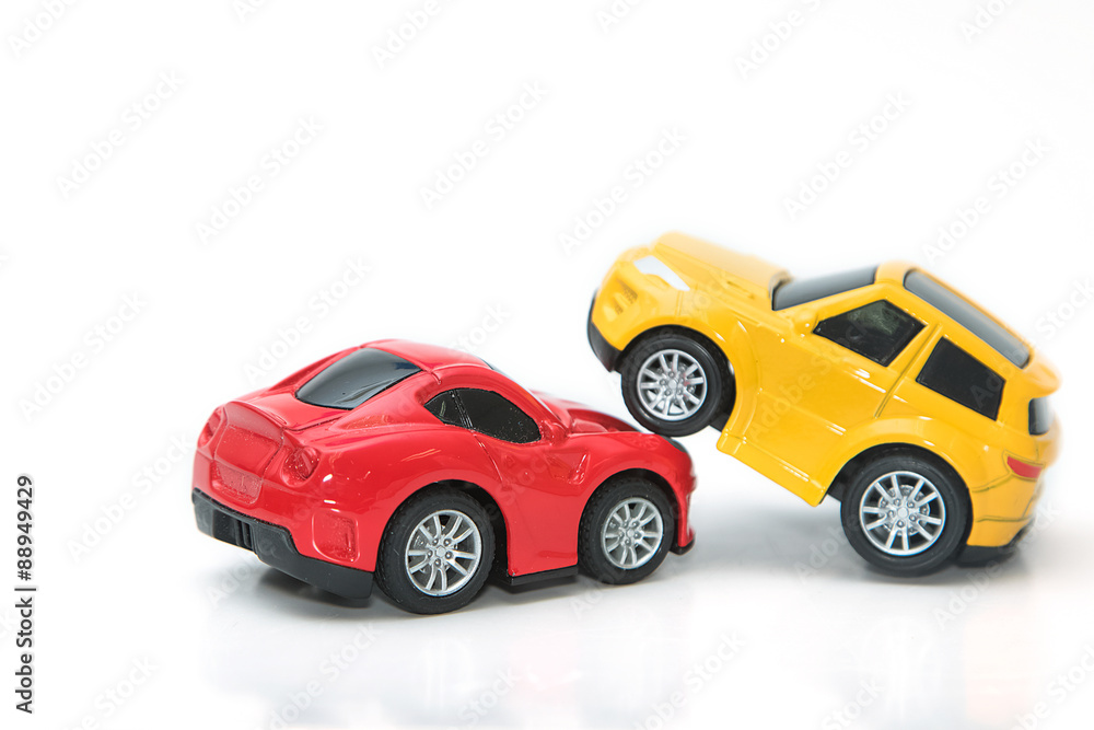Toy cars in accident on a white background ,concept safety car Toy cars in accident on a white background ,concept safety car