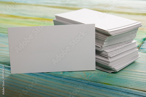 White blank corporate identity business visit card on wooden background