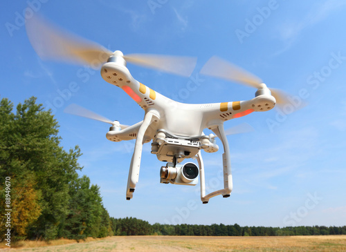 Drone quadrocopter with high resolution digital camera. New tool for aerial photo and video.